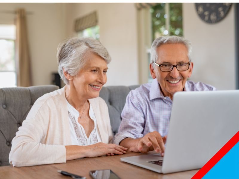 senior couple using laptop